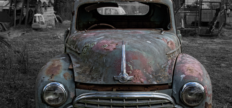 Old car in a vacant lot